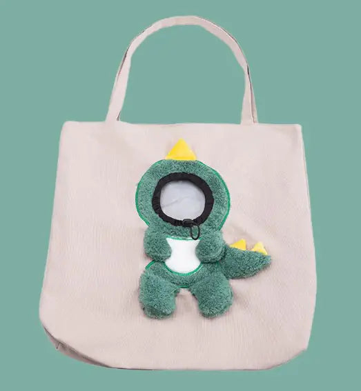 Beige pet carrier bag with a bunny and flower design on a light blue background