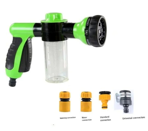 Green and black garden hose spray nozzle with connectors on a white background
