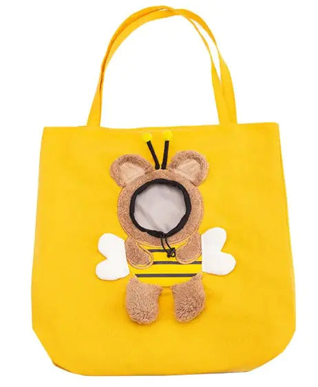 Yellow pet carrier bag with a bunny and flower design on a light blue background