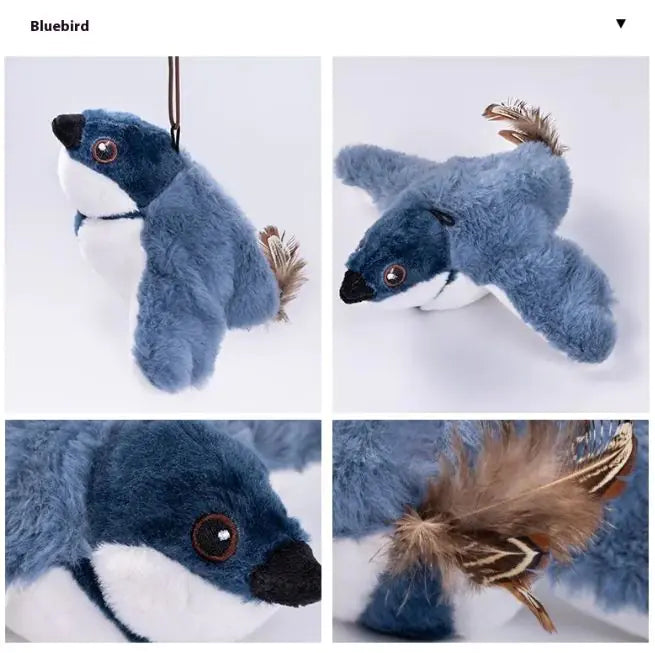 Blue plush toy with feather details on a white background