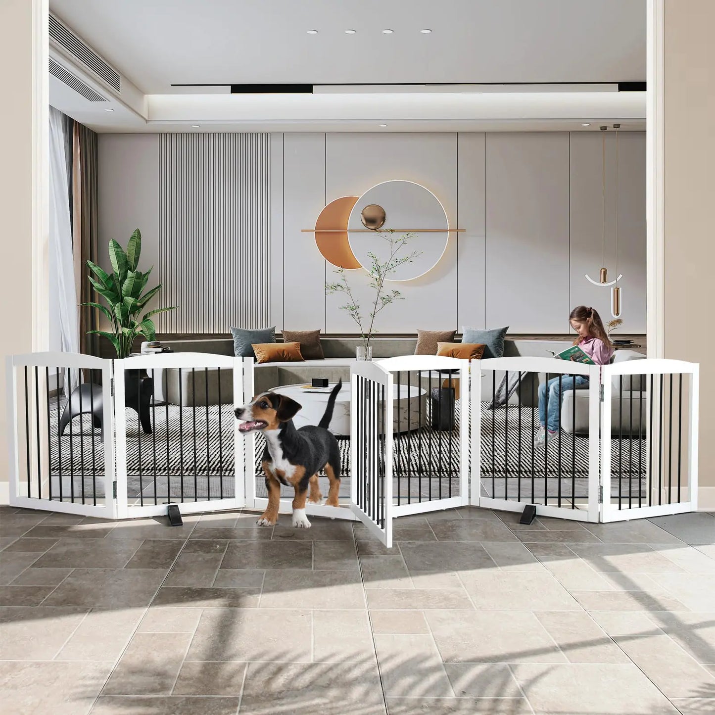Dog standing inside a white pet gate in a modern living room.