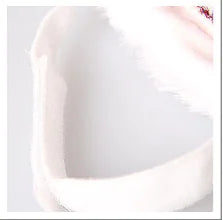 Close-up of a white ceramic bowl on a light gray background