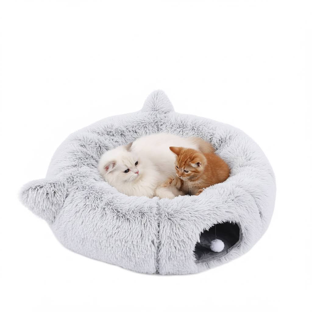 Two kittens on a gray cat-shaped cat tunnel bed on a white background