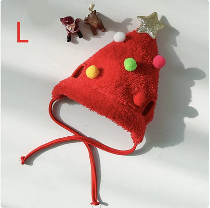 Red fuzzy Santa pet hat with colorful pom-poms and a star on a white background