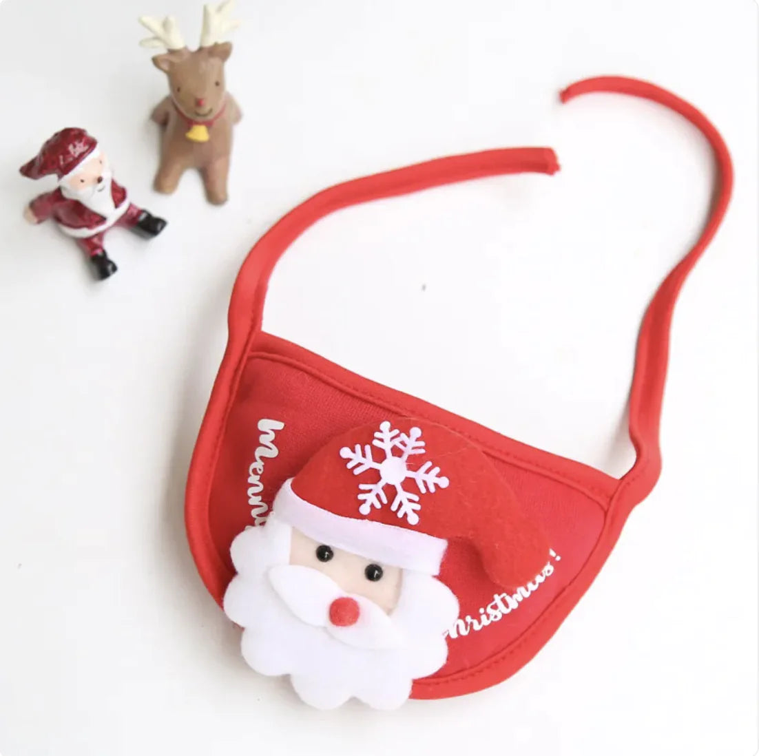 Red Christmas-themed pet bib with Santa Claus design on a white background