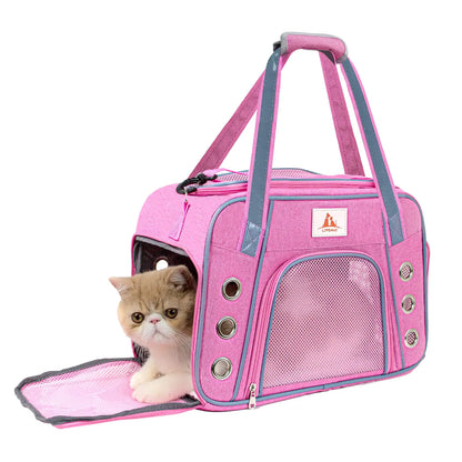 Pink pet carrier with a cat peeking out on a white background